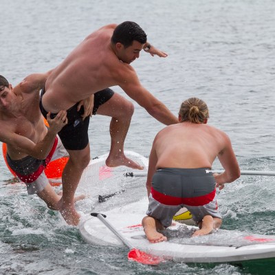 Guy tackle another player on SUPBALL