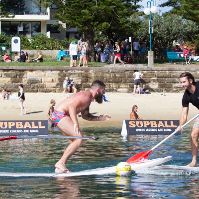Guys playing SUPBALL in Manly