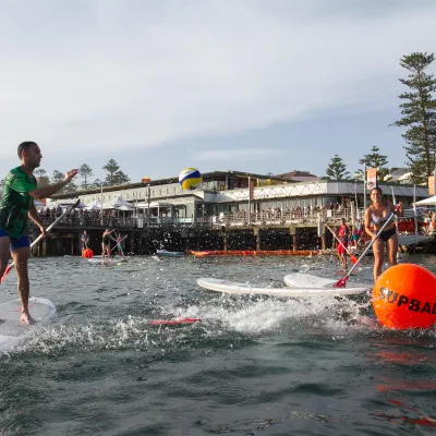 People playing SUPBALL game in Manly