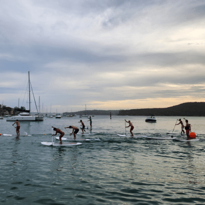 a group of people in a boat on a body of water