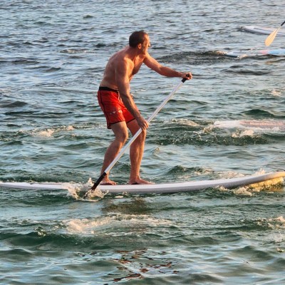 a man riding a surfboard in the water