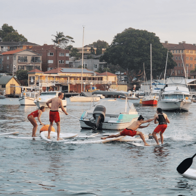a group of people that are standing in the water