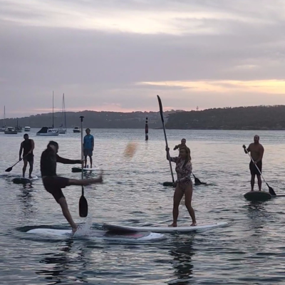a group of people that are standing in the water